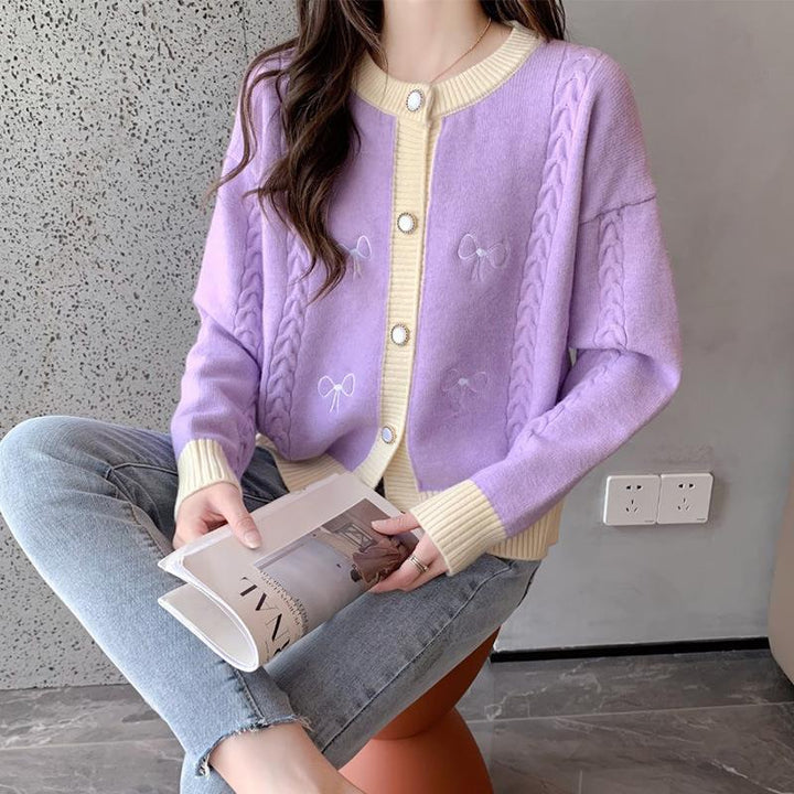 Ladies comfortable knitted cardigan with bow appliqués and a cable pattern Lune London