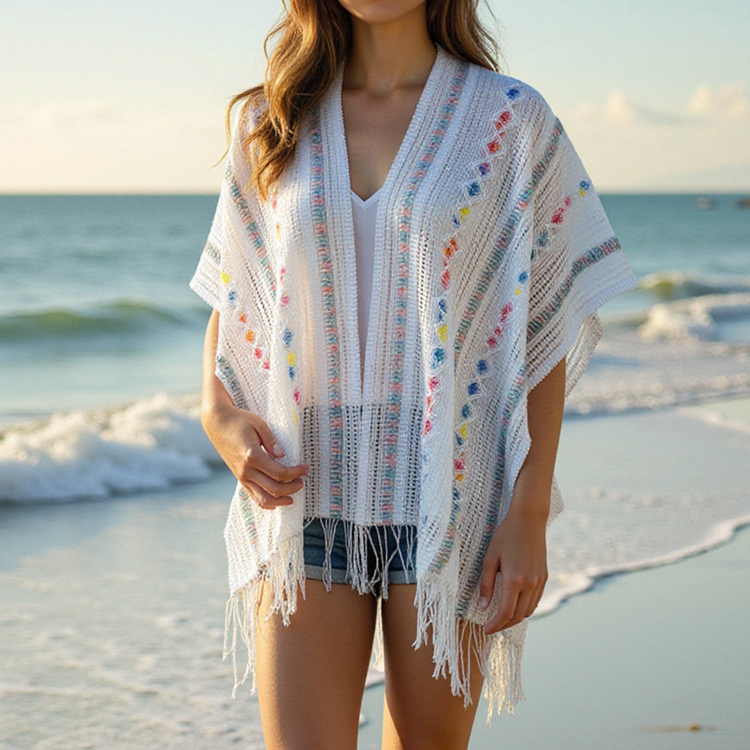 Ladies casual poncho with fringe details and a chic and stylish colorful pattern