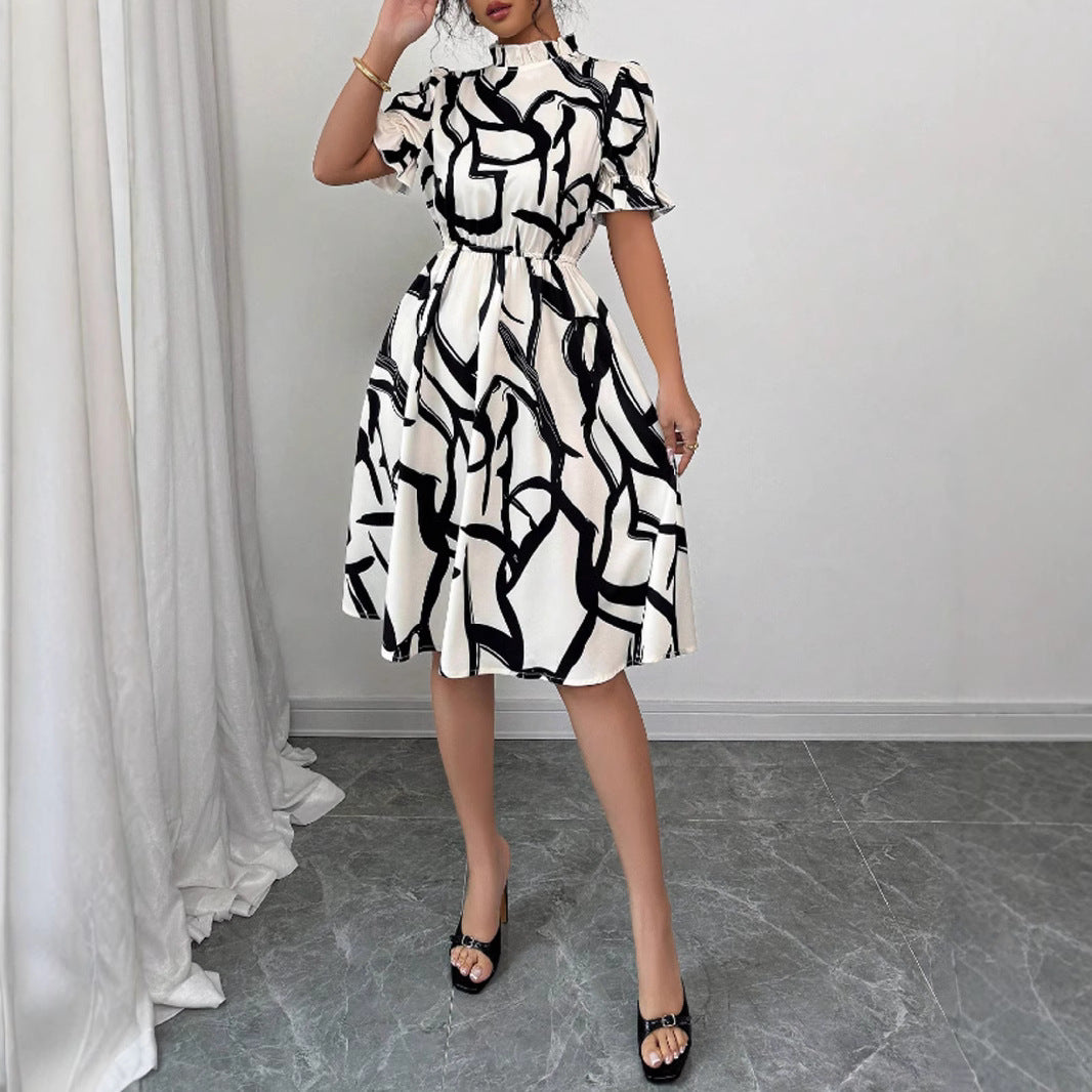 Robe midi élégante pour femmes avec motif de plantes stylé et taille élastique Chic & Stil