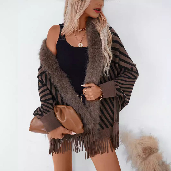 Ladies knitted poncho with elegant faux fur collar and fringe design Lune London