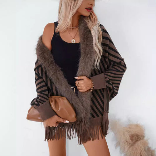 Ladies knitted poncho with elegant faux fur collar and fringe design Lune London