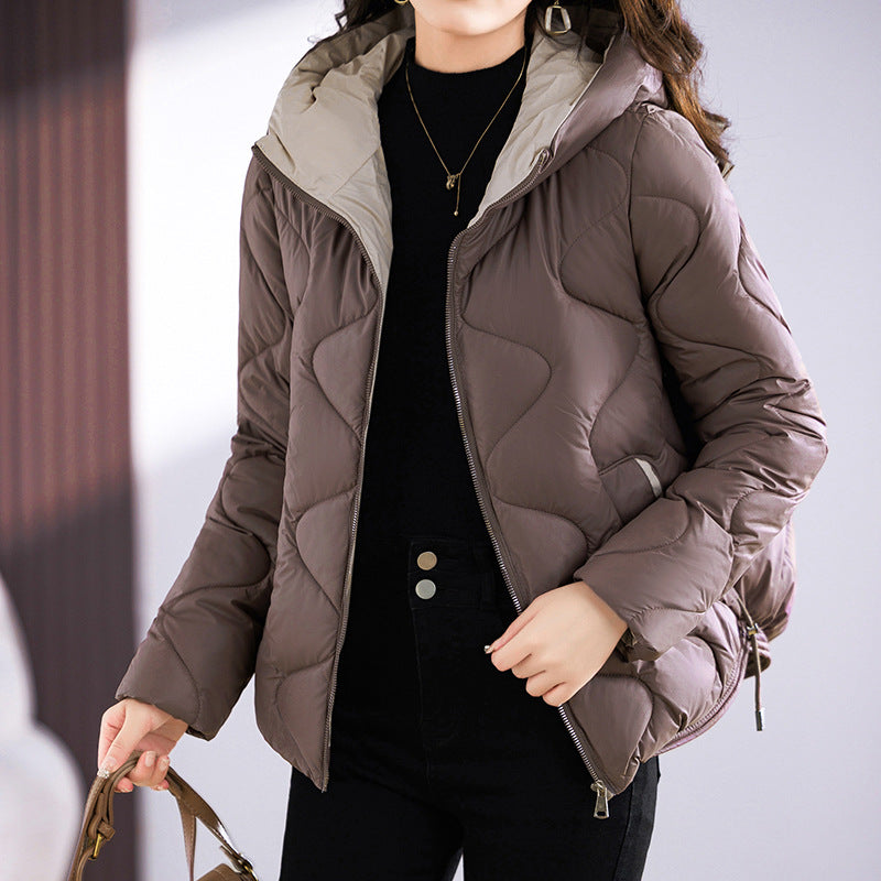 Insulated quilted jacket for women with high collar and practical zip pockets Lune London