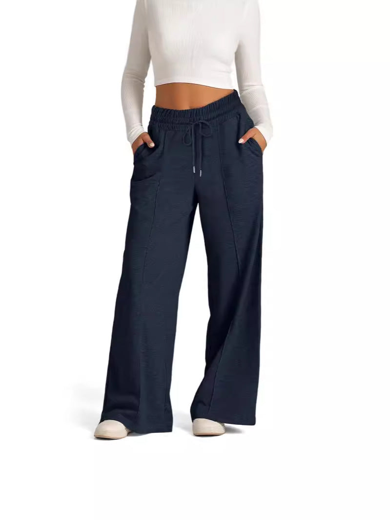 Loose leisure pants for women with elastic waistband and practical side pockets Lune London