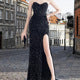Women's glamorous evening dress with off-shoulder design and shimmering sequins Lune London