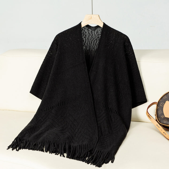 Elegant knitted poncho for women with fringe details and a distinctive pattern Lune London