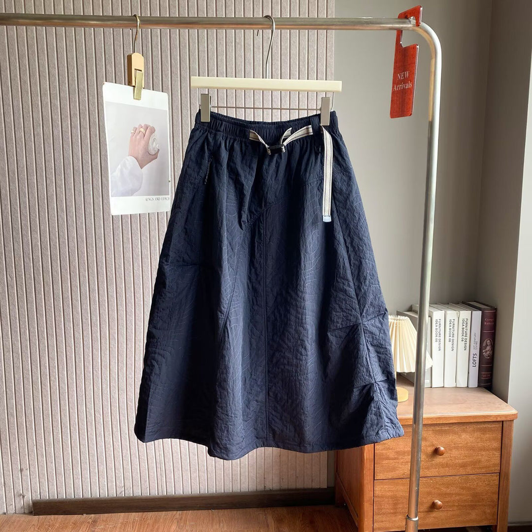 Jupe midi élégante pour femmes avec taille élastique pratique et poches latérales Chic & Stil