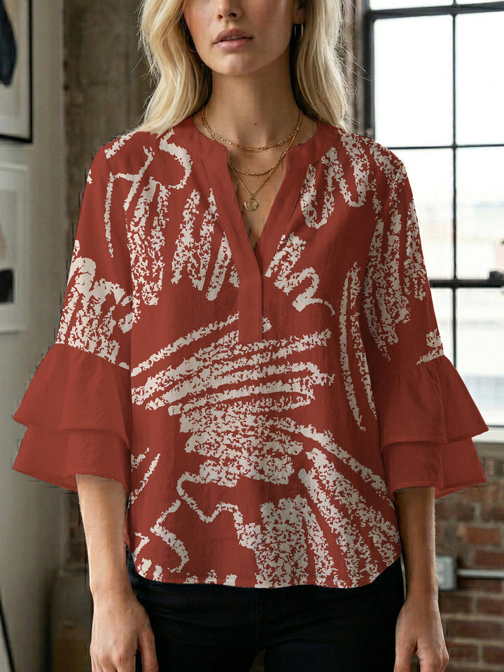 Ladies elegant blouse shirt with voluminous puff sleeves and graphic floral design Lune London