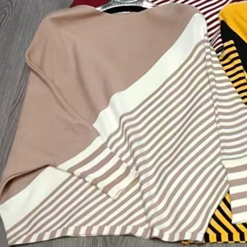 Fashionable knitted sweater for women with asymmetrical cut and graphic striped pattern Lune London