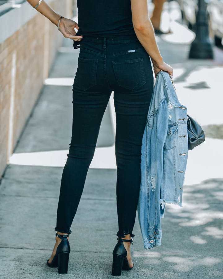 High waisted jeans for women with a modern cut featuring button detail and frayed hem Lune London