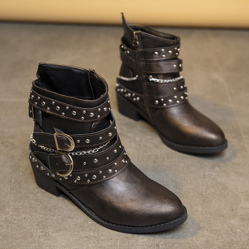 Trendy women's ankle boots with decorative straps and chain elements Lune London