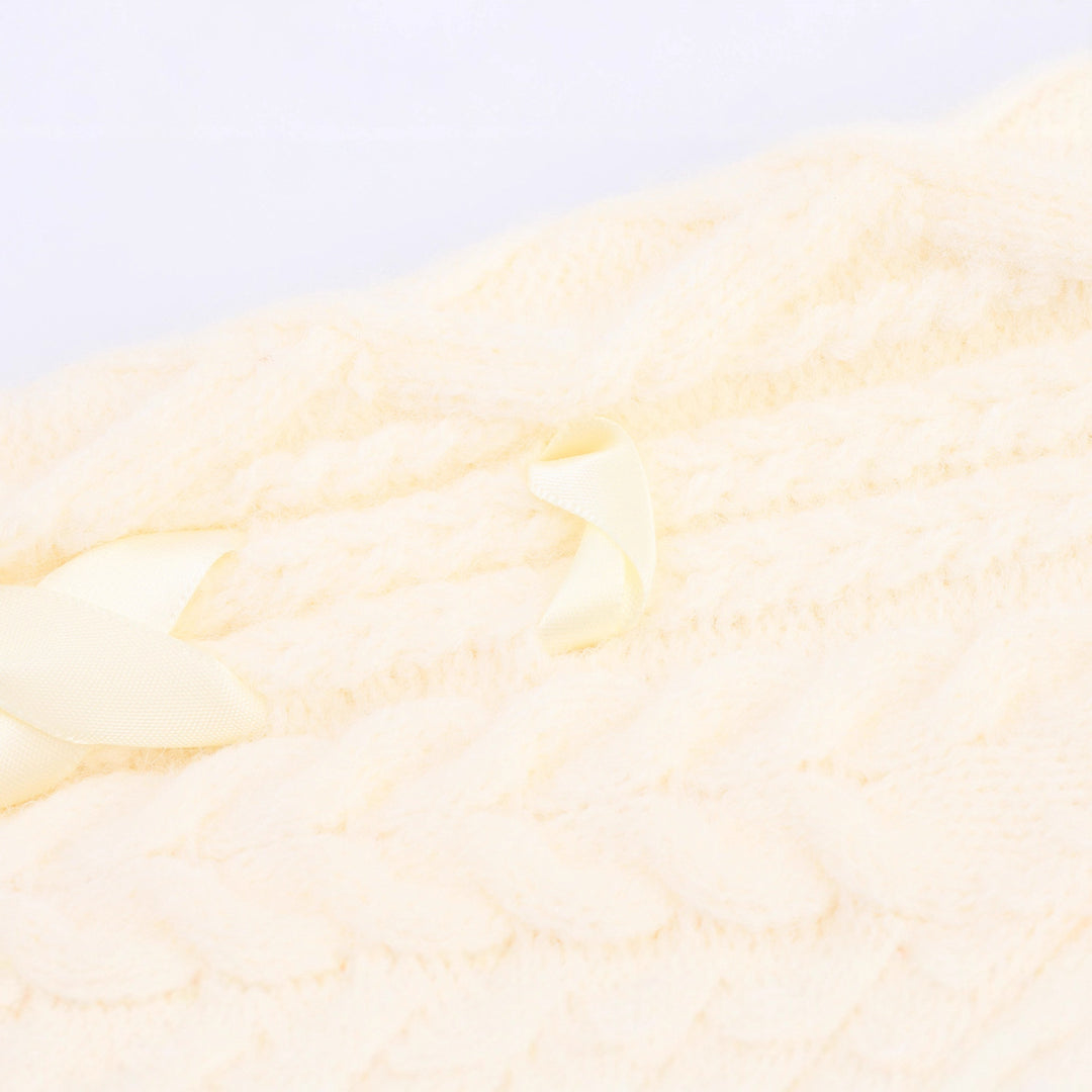 Knitted jacket for women with cable pattern and decorative button details Lune London