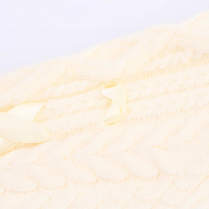 Knitted jacket for women with cable pattern and decorative button details Lune London