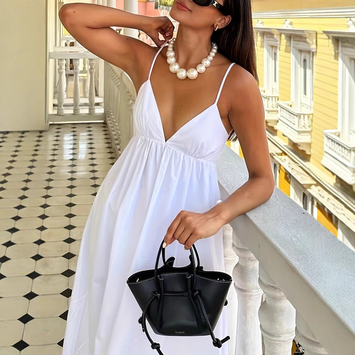 Lightweight summer dress for women with deep V-neck and spaghetti straps Lune London