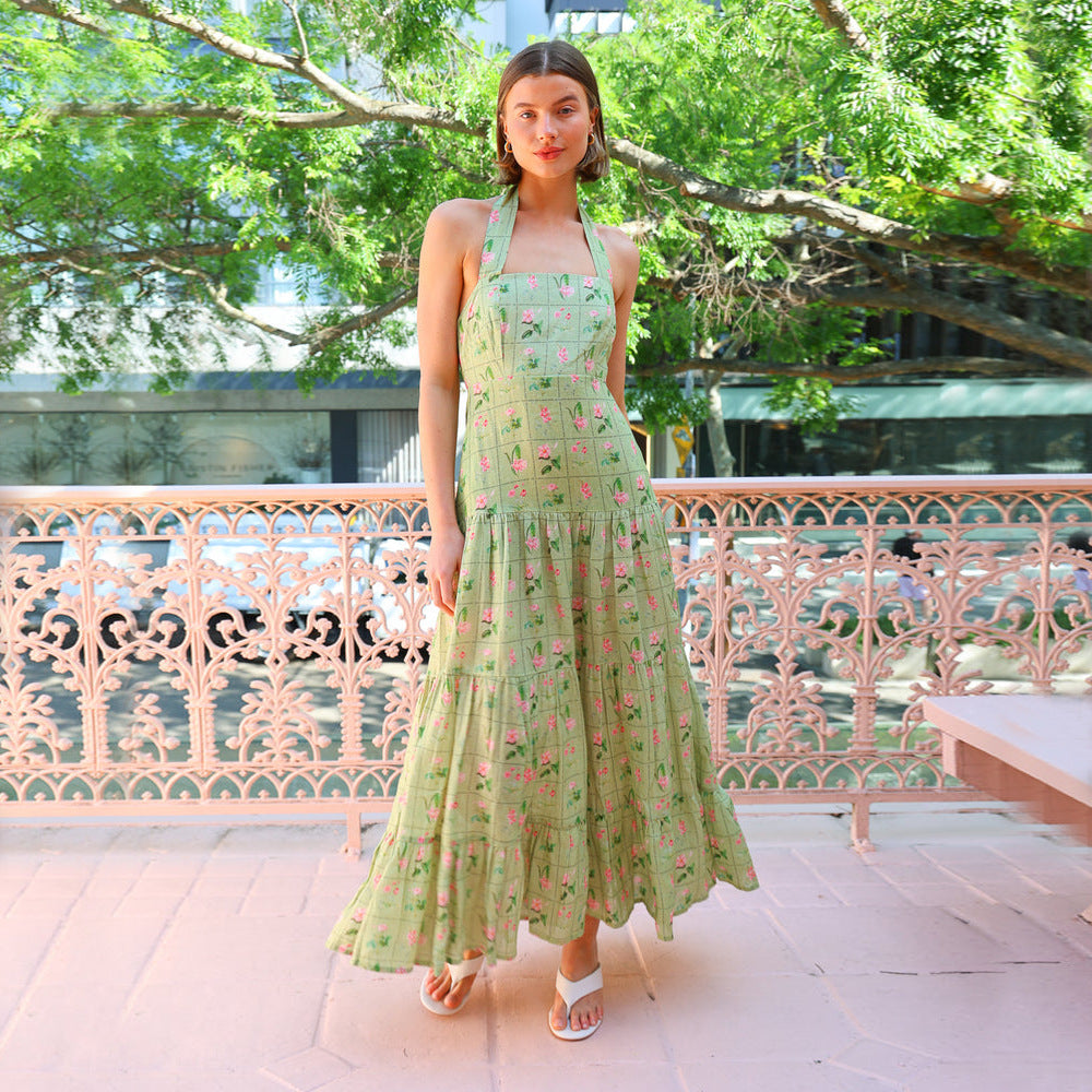 Women’s maxi dress with playful halterneck design and floral pattern mix Lune London