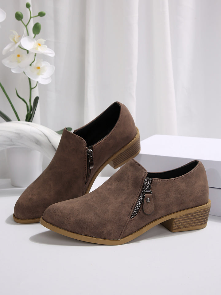 Trendy ankle boots for women with a chic zipper design Lune London