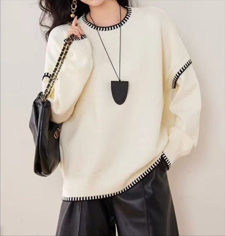 Pull confortable pour femme avec ourlet texturé et accents modernes Chic & Stil