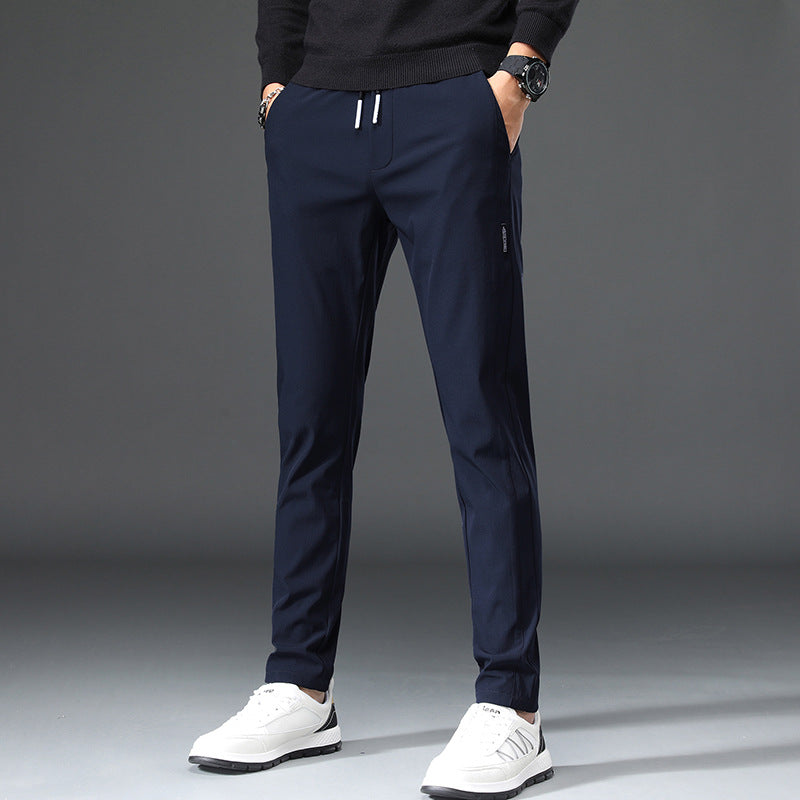 Men's slim fit sports pants with elastic waistband and practical zip pockets Lune London