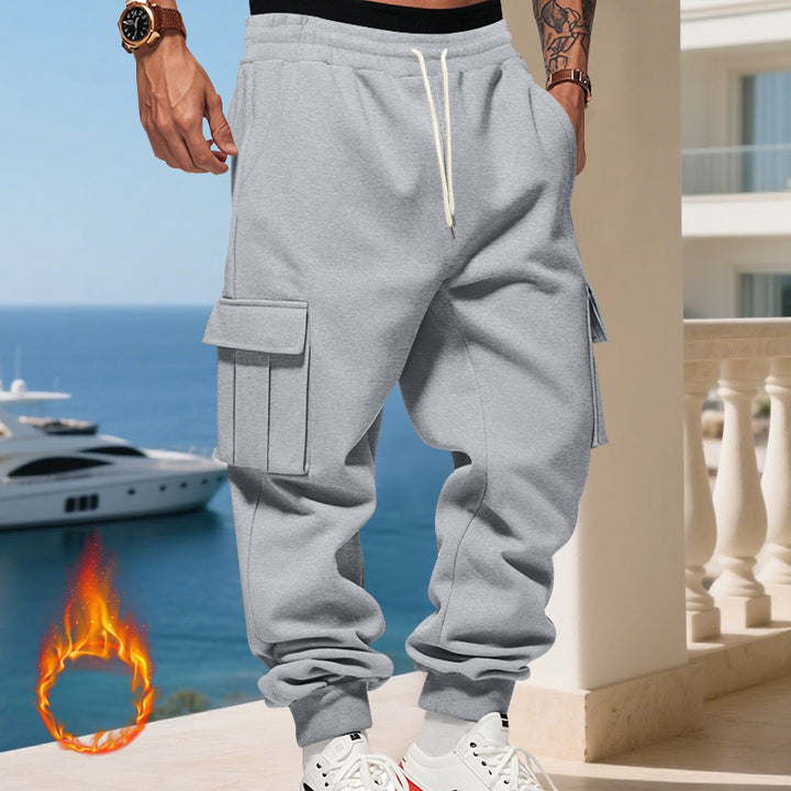 Men's cargo joggers with side pockets and elastic waistband. Chic and style.