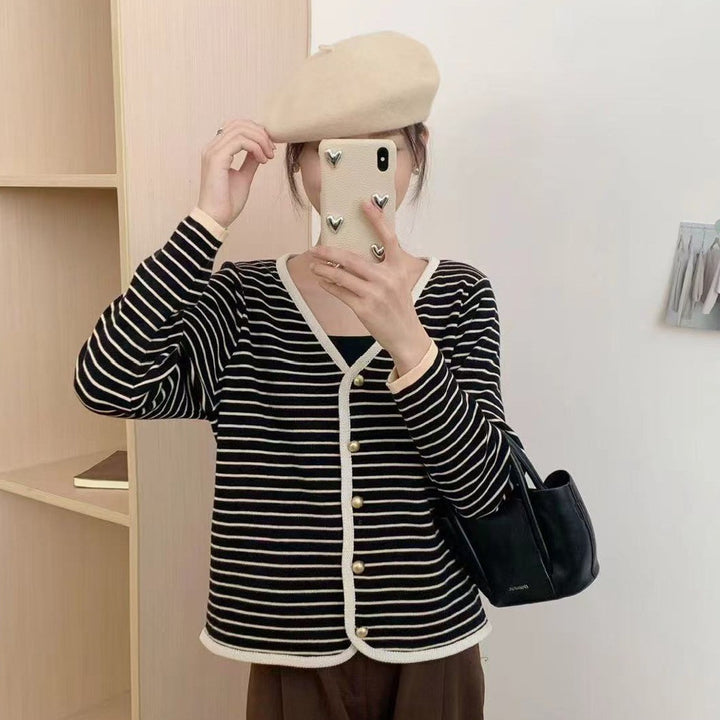 Ladies striped cardigan with elegant buttons and modern V-neck