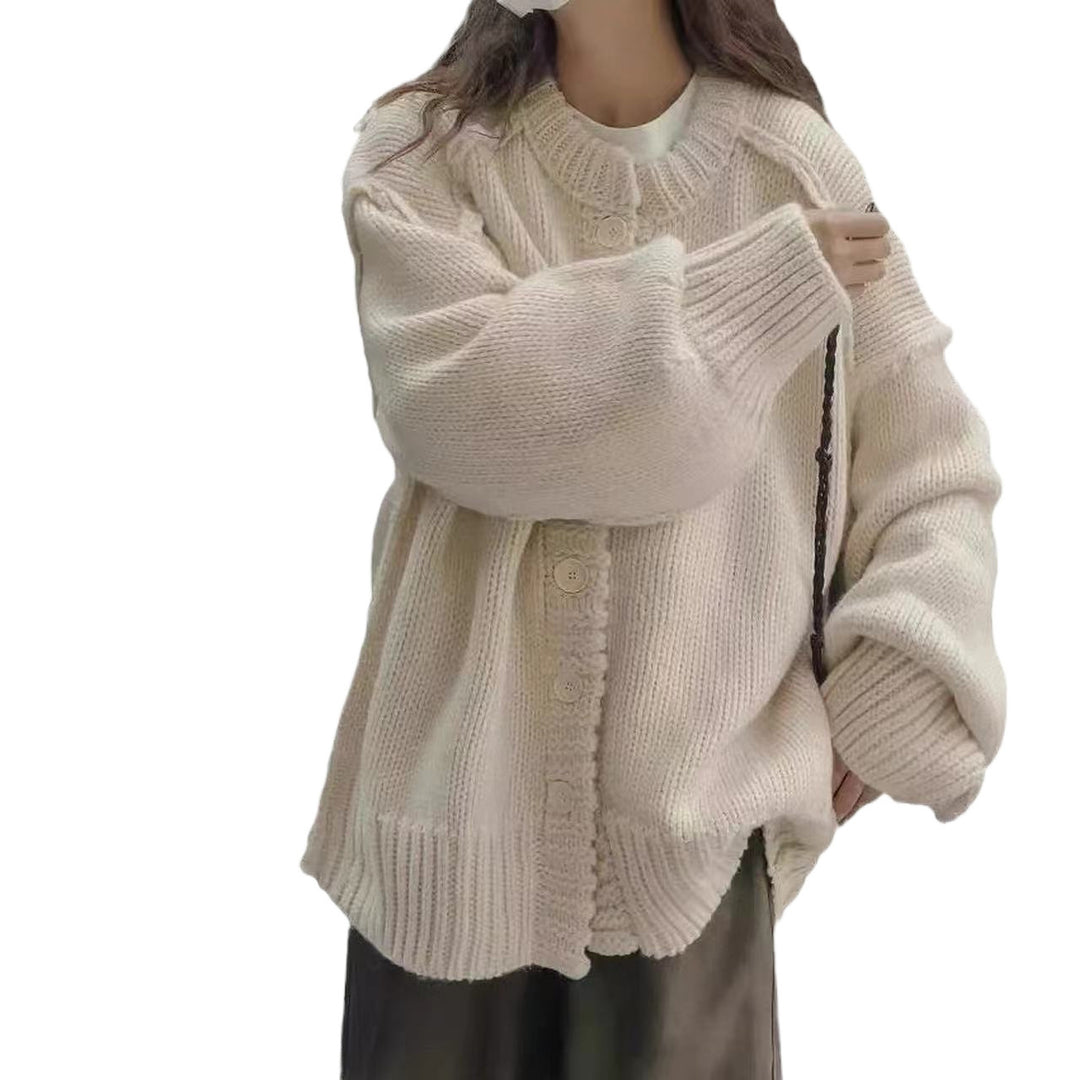 Oversized knitted jacket for women with special button details and wide sleeves Lune London