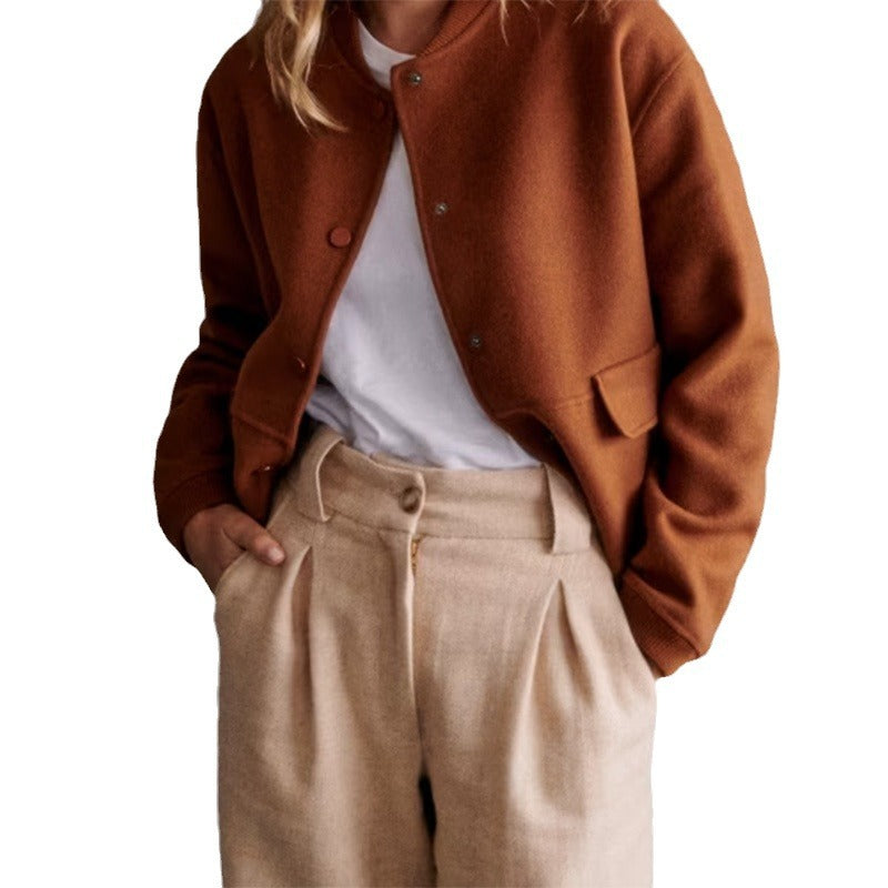 Modern short jacket for women with button details and side pockets. Chic and style