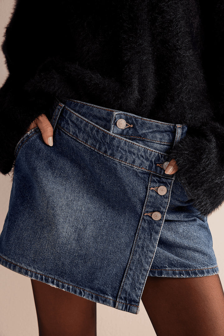 Women's fashionable A-line denim skirt with asymmetric button design and practical pockets Lune London
