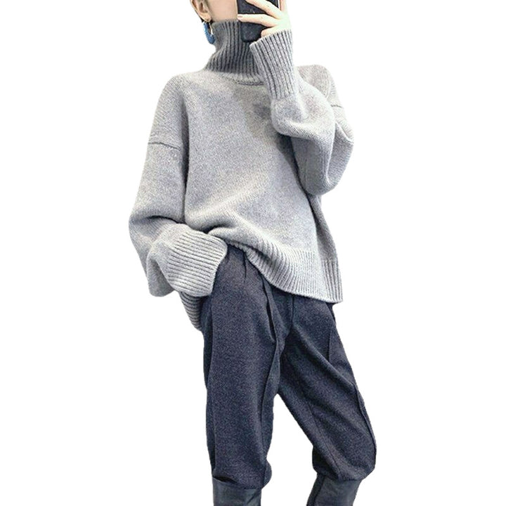 Pull col roulé pour femmes avec des manches larges et une structure en ribbing Chic & Stil