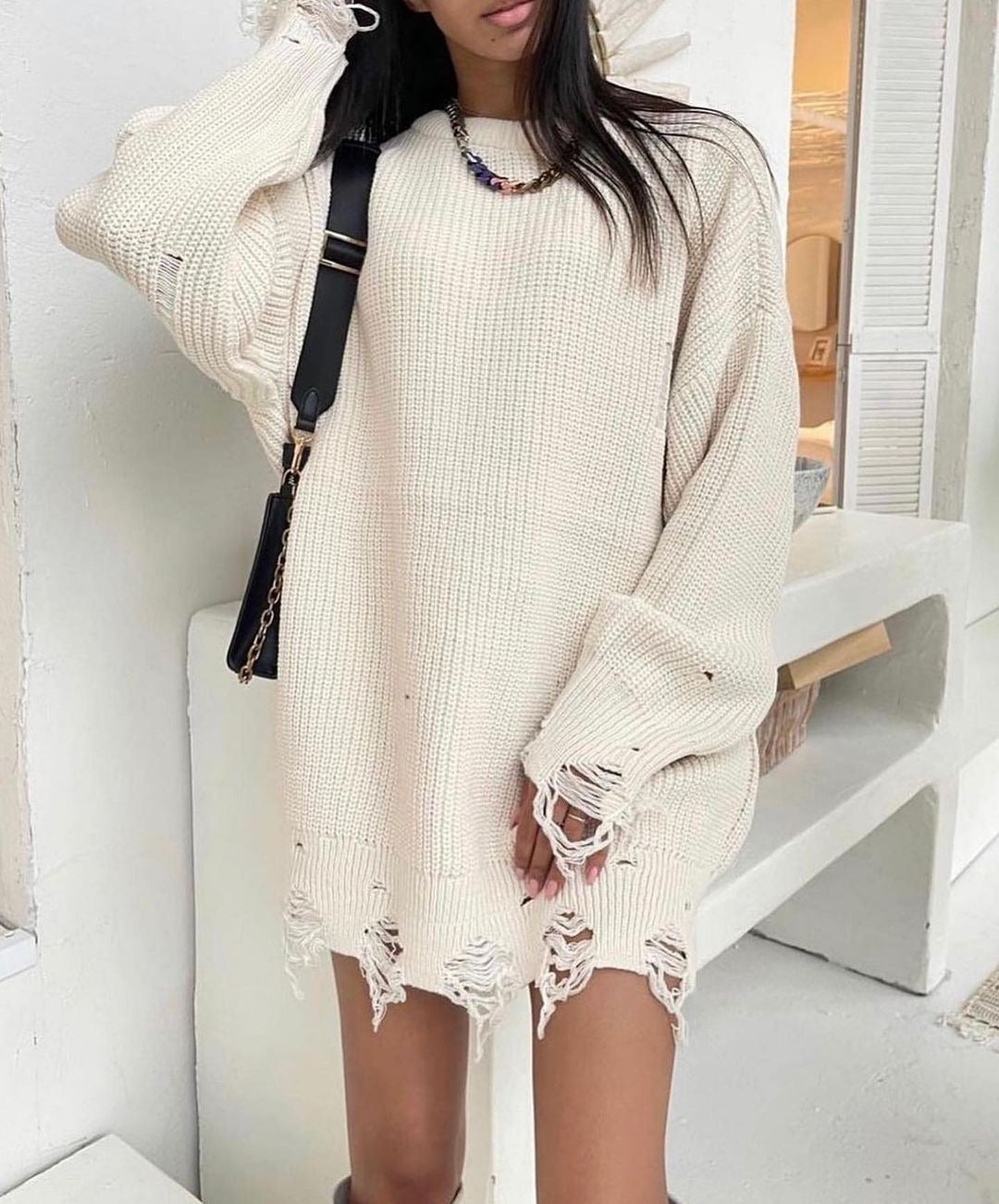 Women Large knit sweater with torn hem Lune London