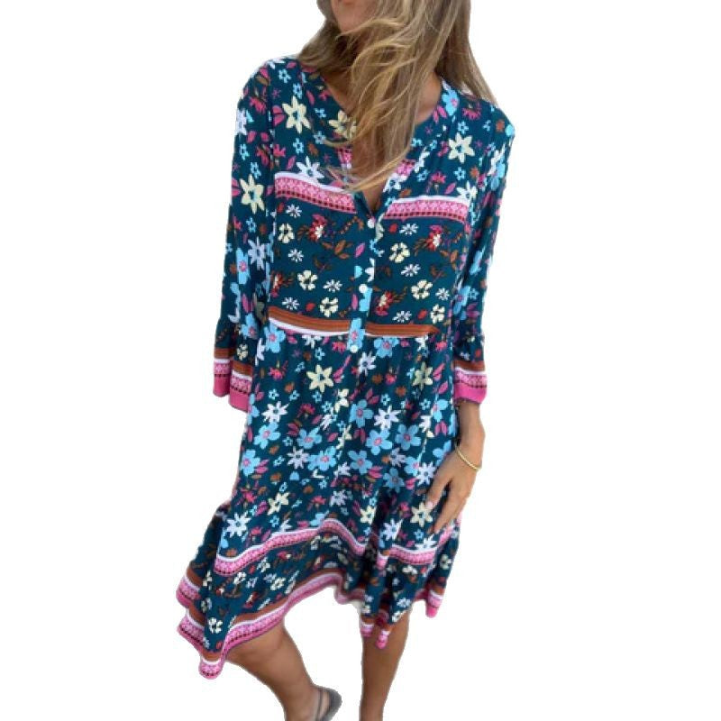 Casual blouse dress for women with a colorful floral pattern and a flared knee hem Lune London