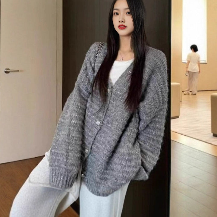 Knitted jacket for women with voluminous sleeves and a unique mesh structure Lune London