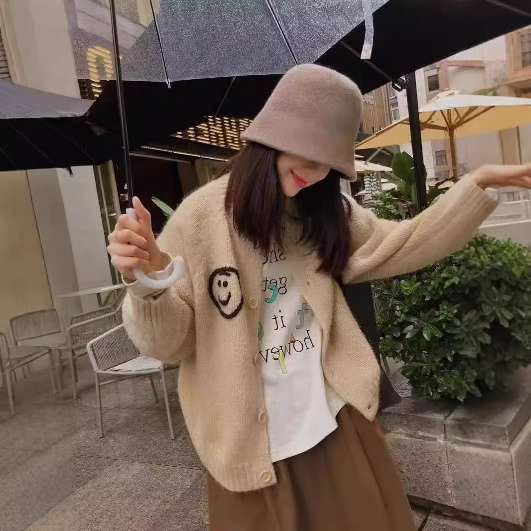Women's cardigan and comfortable knit with playful Smiley pattern Lune London