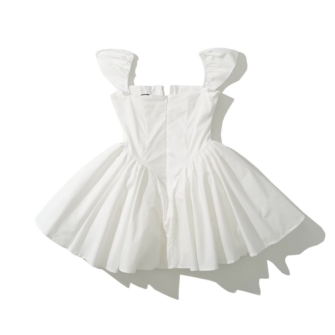 Mini dress for ladies with voluminous ruffle elements and a button detail Lune London