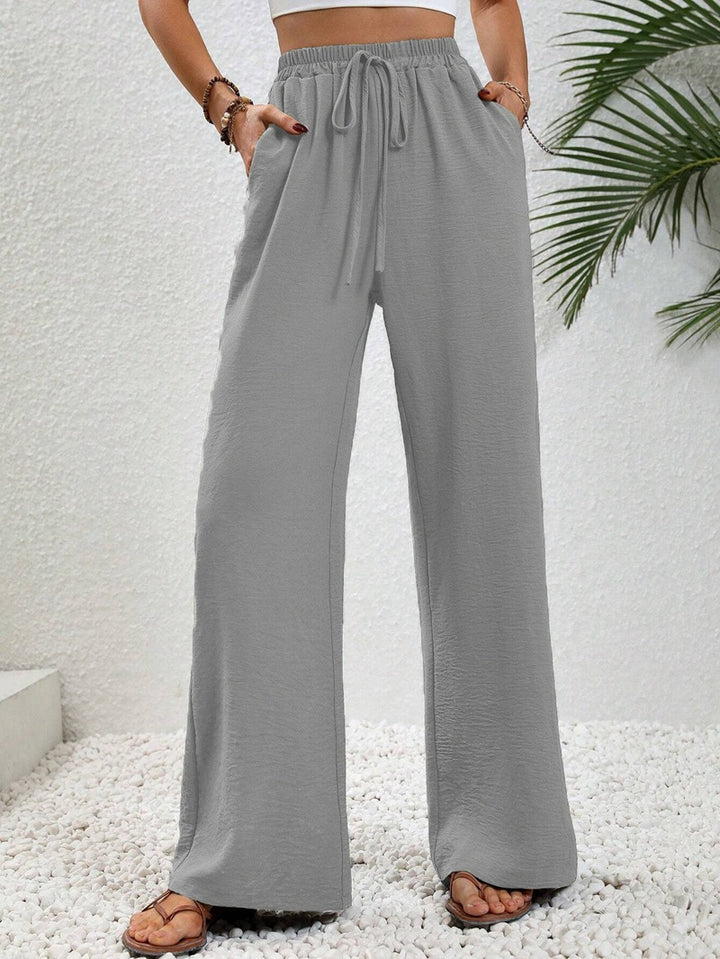 Pantalons larges d'été pour femmes avec taille élastique et poches latérales pratiques Chic & Stil