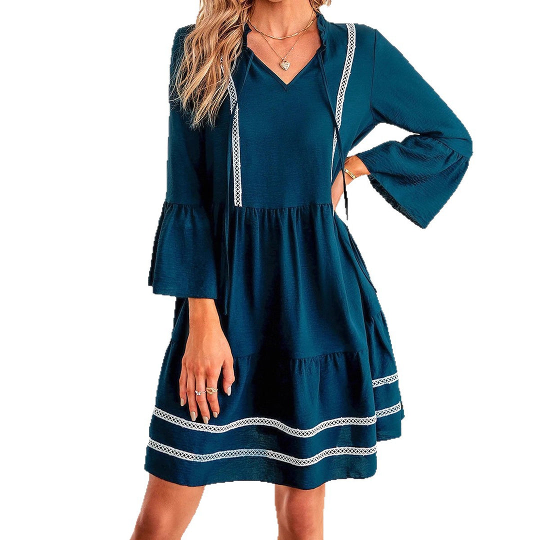 Casual mini dress for women with V-neck, decorative sleeve cuffs and playful hem Lune London
