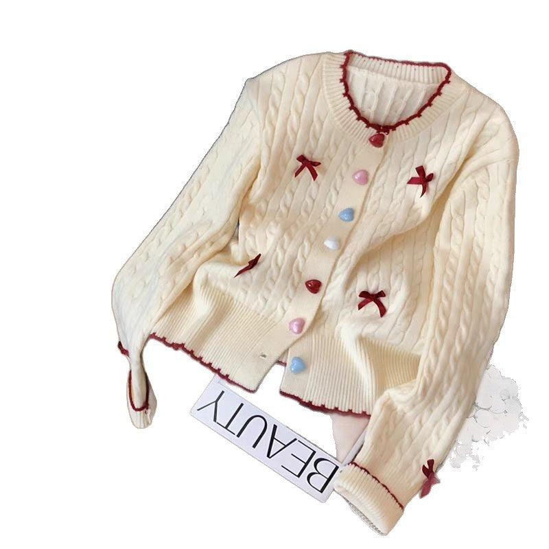 Cardigan pour femmes avec motif en câble et embellissements ludiques Chic & Stil