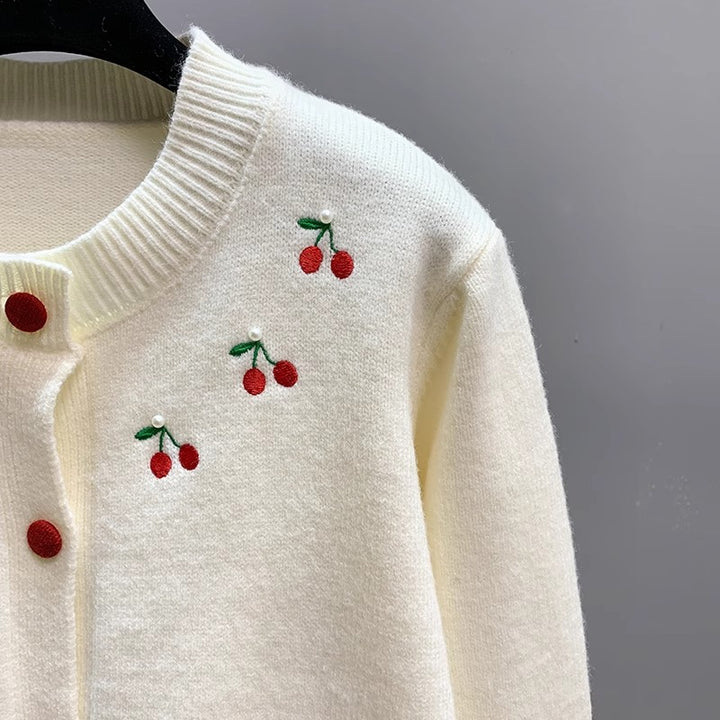 Ladies playful cardigan with embroidered cherries and red buttons Lune London
