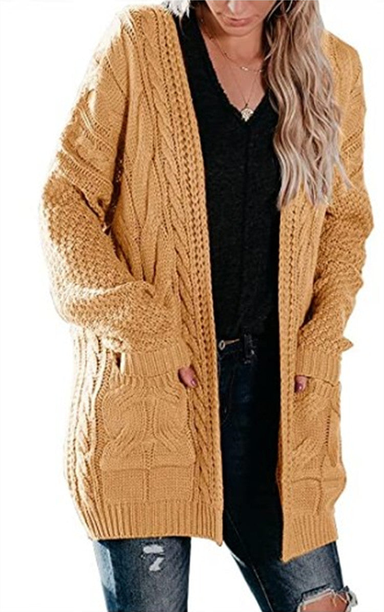 Ladies chunky knit cardigan with a striking cable structure and practical pockets Lune London