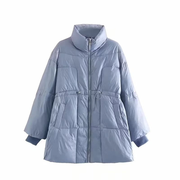 Quilted transition jacket for women with high collar and practical side pockets Lune London