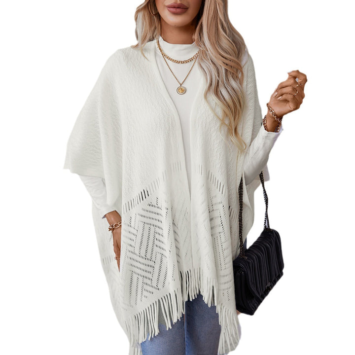 Elegant knitted poncho for women with fringe details and a distinctive pattern Lune London