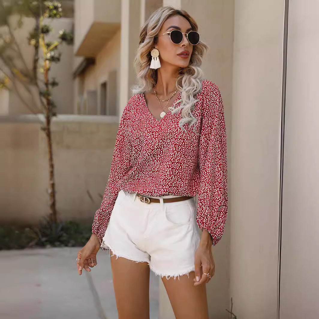 Women’s blouse with voluminous sleeves and V-neck Lune London