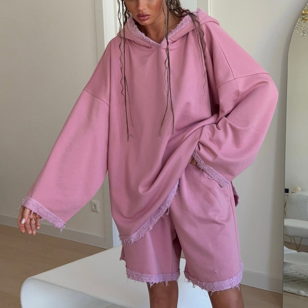 Ladies oversized sporty hoodie with frayed details and chic and stylish shorts set
