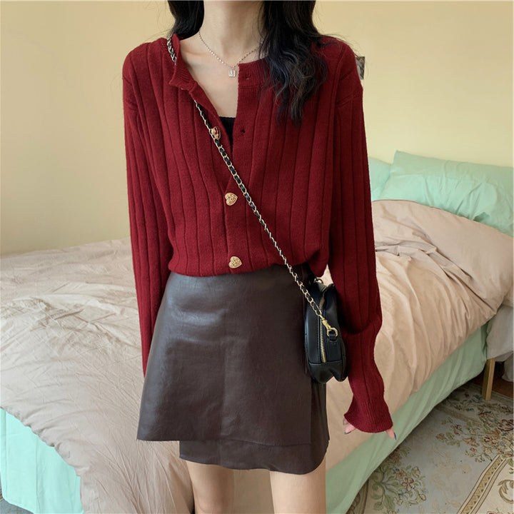 Women's knit jacket with a decorative button design and a vertical ribbed pattern Lune London