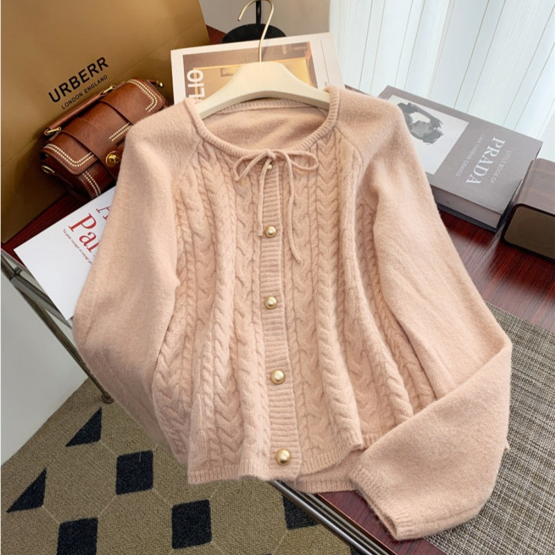 Women’s knitted jacket with embossed pattern and decorative button details Lune London