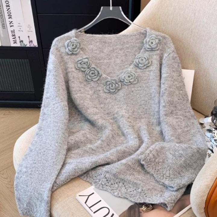 Pull en maille pour femmes avec accents floraux Chic & Stil
