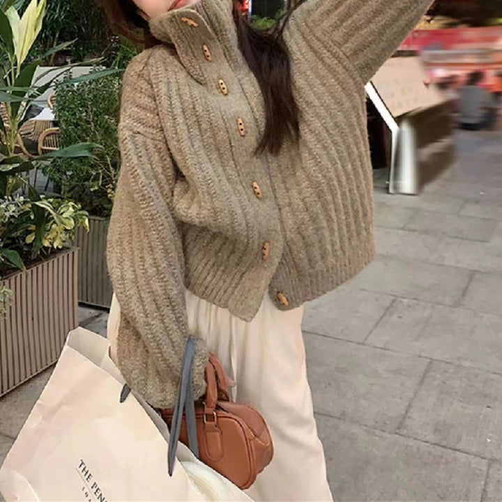 Cozy knitted sweater for women with a high collar and button details Lune London