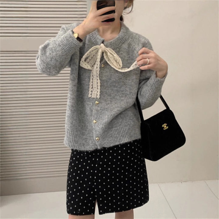 Women's knit jacket with playful lace ribbon and golden heart-shaped buttons Lune London