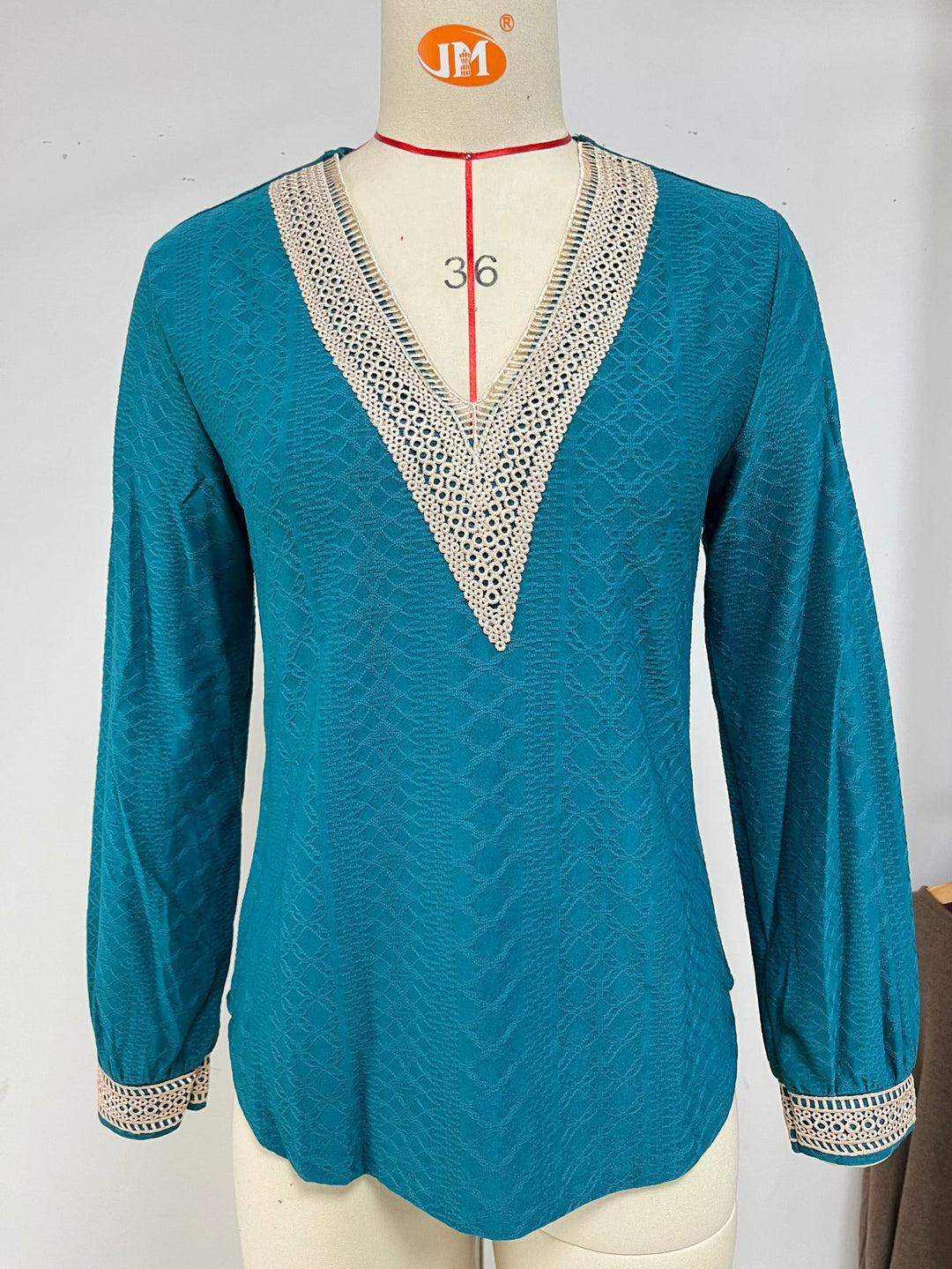 Long sleeve blouse shirt for women with decorative V-neck and crochet elements Lune London