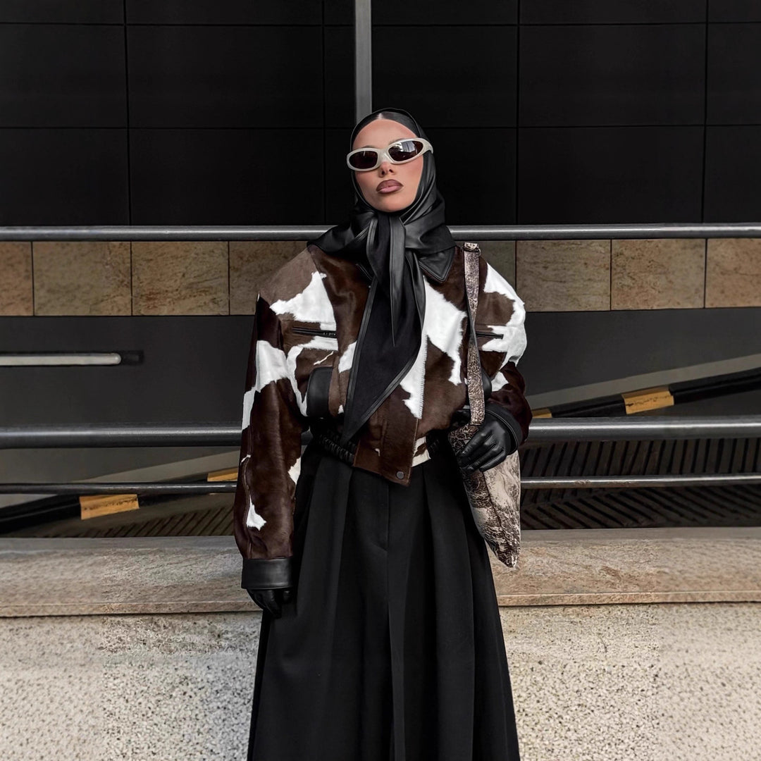 Ladies stylish faux leather jacket with a modern design in chic animal fur