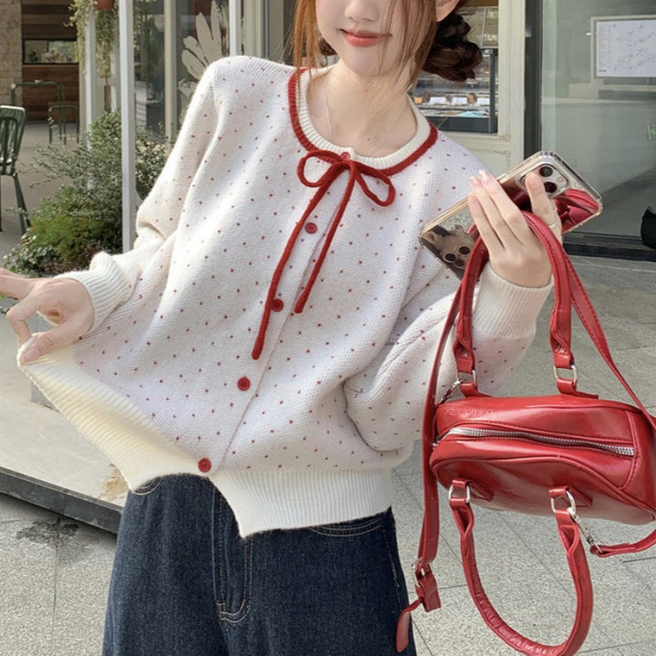 Cardigan féminin avec des pois et un nœud Chic & Stil