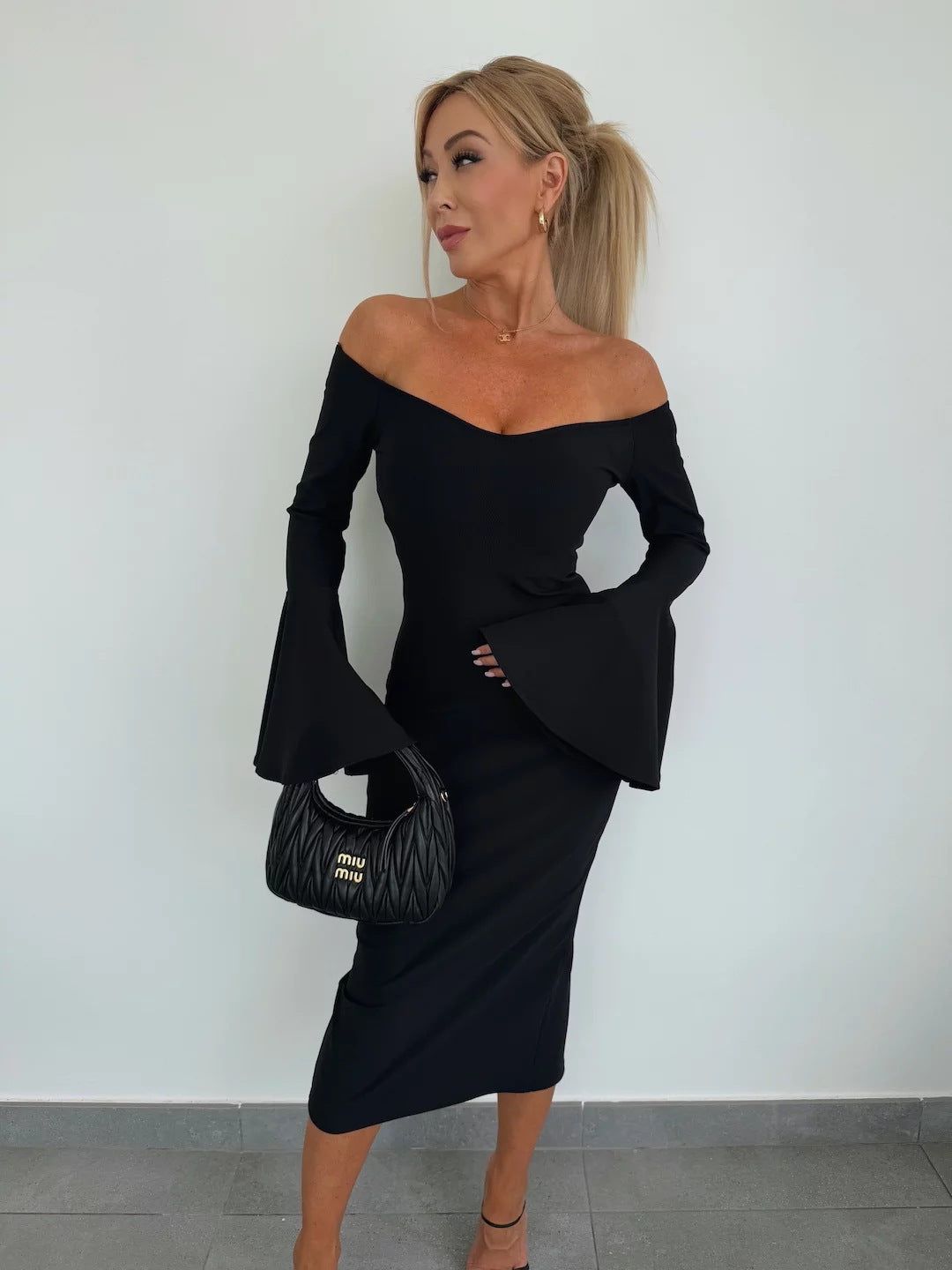 Fitted wrap dress for women with a deep neckline design and wide sleeves Lune London
